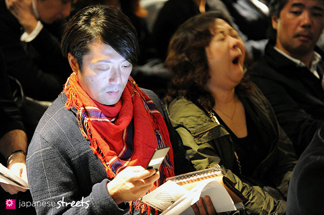 111021-1539: Visitors waiting for a fashion show to start at the Japan Fashion Week in Tokyo