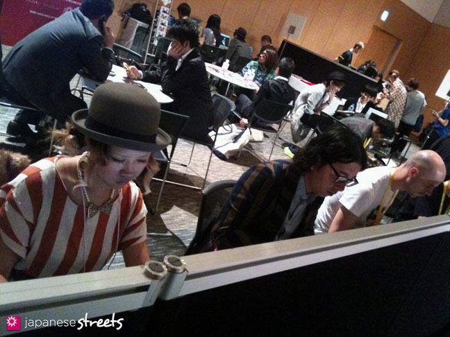 111017-0496: Anzu inputting data at the media lounge during the Japan Fashion Week in Tokyo
