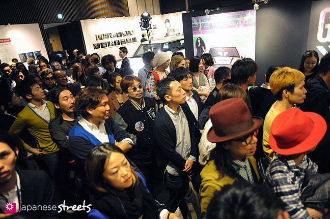 111019-8911: Visitors leaving the Yoshio Kubo show at the Japan Fashion Week in Tokyo