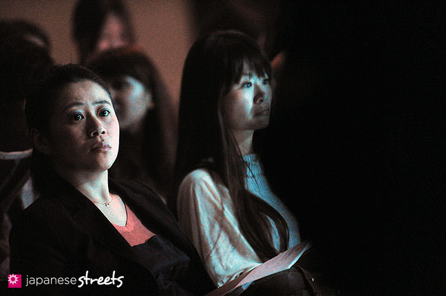111019-8913: Visitors wait for a show to start at the Japan Fashion Week in Tokyo