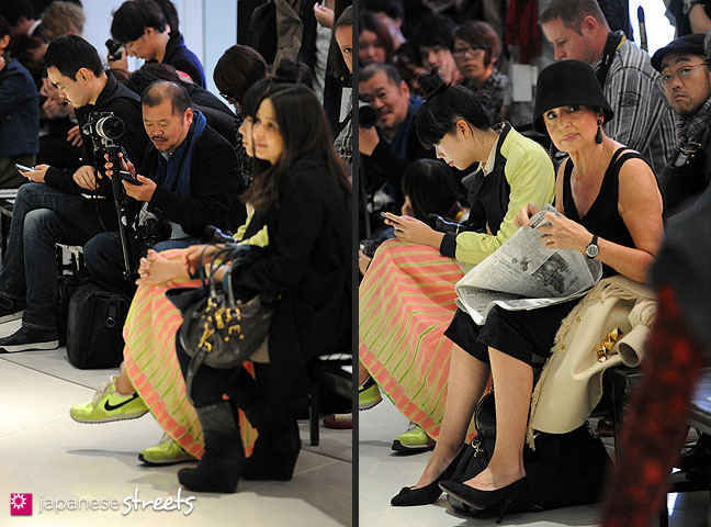 111021-1275-111021-1290: Fashion Essayist Françoise Moréchand (with hat) sitting next to fashion blogger Suzy Lau (in green) at the Japan Fashion Week in Tokyo S/S 2012