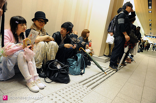 111022-3922: People wait for the mastermind show during the Japan Fashion Week in Tokyo